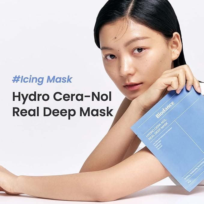 A close-up of a hydrogel face mask in a jar, with the text "Biodance Hydro Cera-Nol Real Deep Mask" printed on the jar.